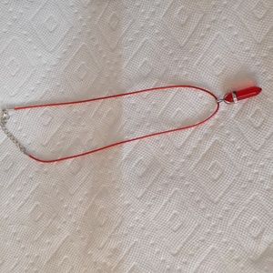 Red bullet crystal on matching cord